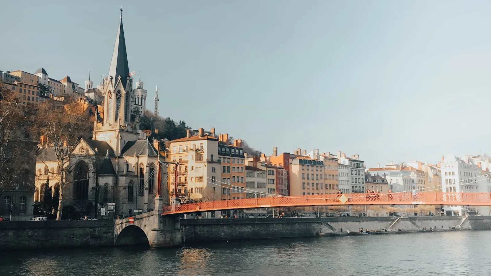 brown concrete building near river during daytime_Lyon